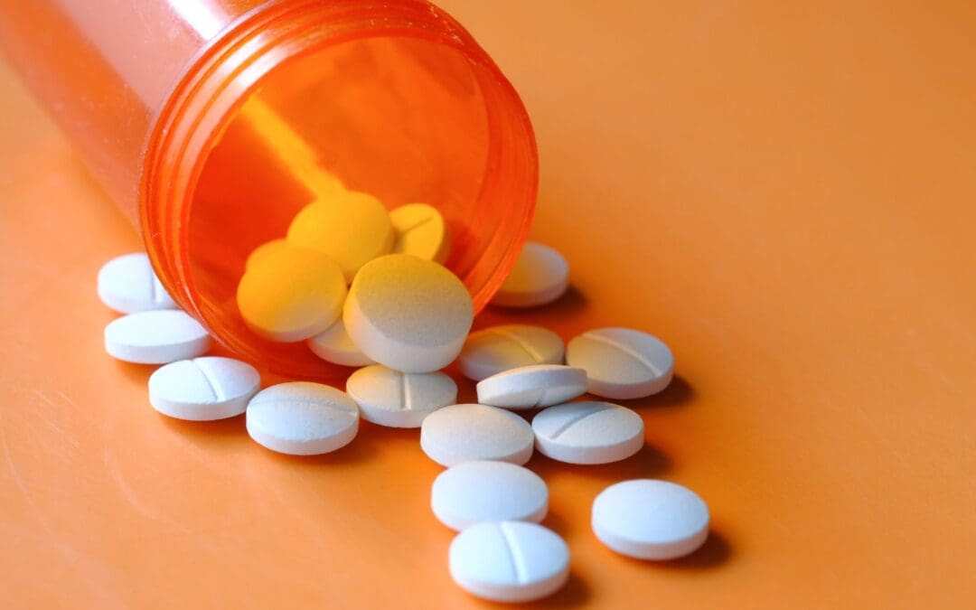 → Abortion pills spilling from bottle – medical termination